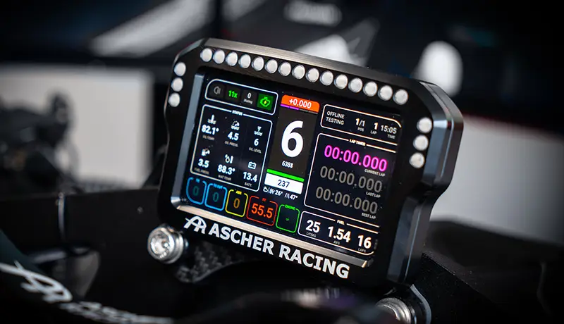 close up shot of an Ascher Racing 5 inch screen on a sim racing set up. Showing all the driving telemetry. The sreen currently shows gear 6